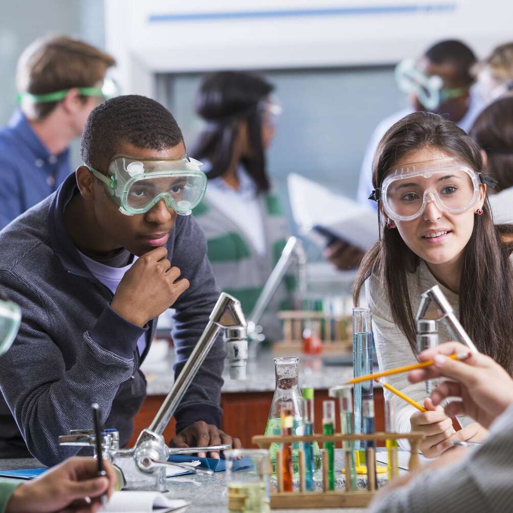 group-of-multi-ethnic-students-in-chemistry-lab-469951129-589c9db33df78c475814246a